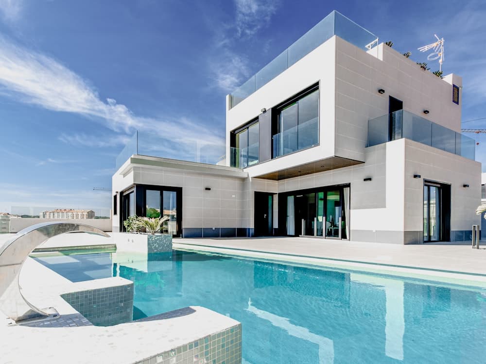 Modern home with a pool, patio, and connected outdoor living space