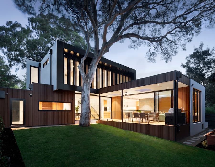 Modern Los Angeles home at dusk with warm interior lighting