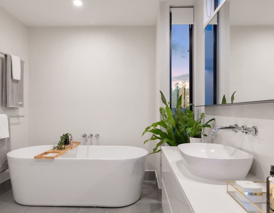 Spa-style primary bathroom with a freestanding soaking tub and dusk window